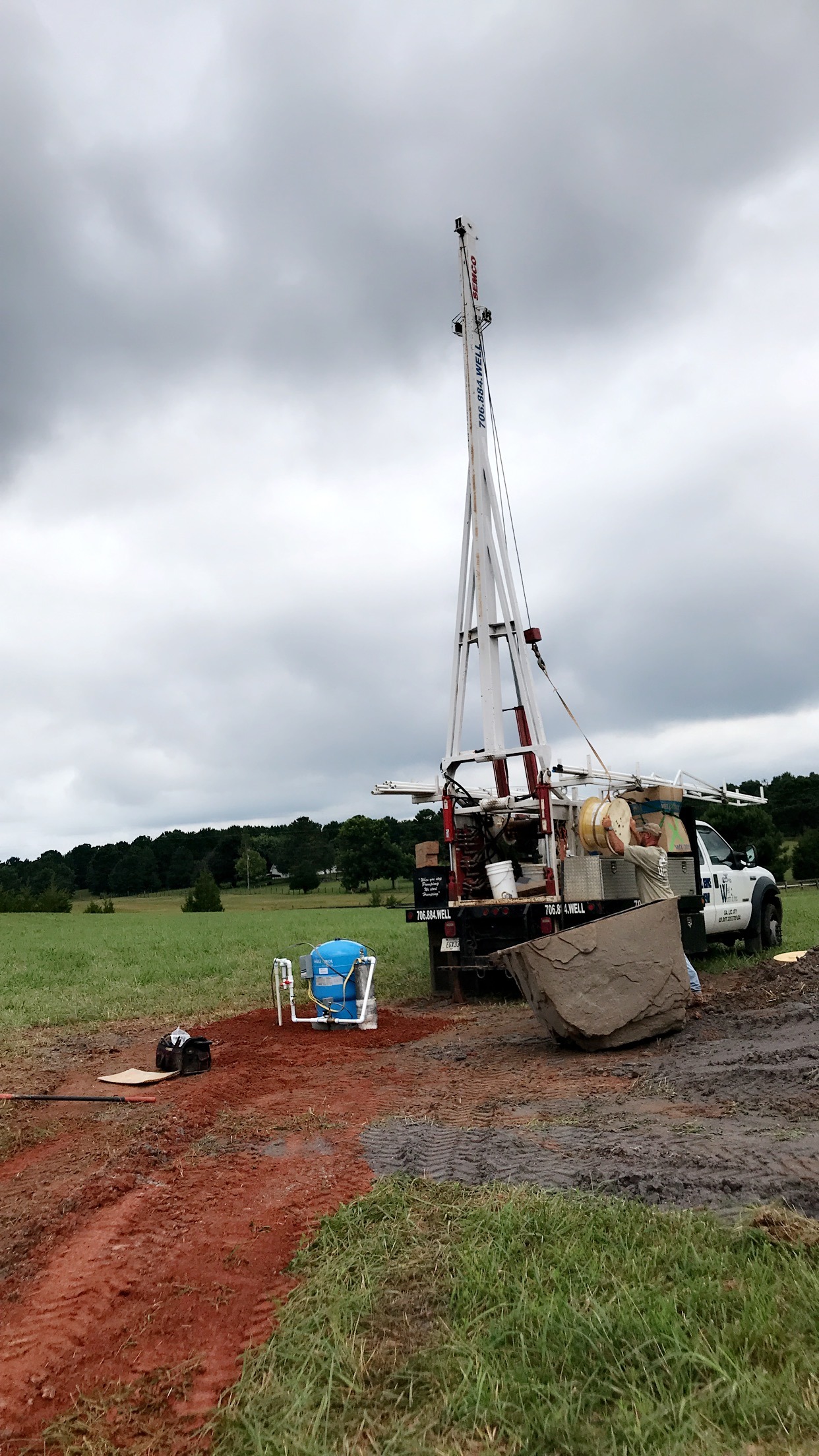 Well Worth It.Inc. white truck having a repair service